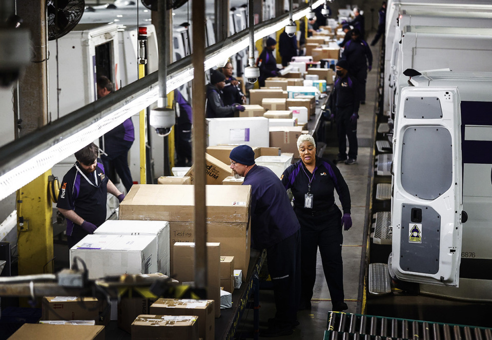 <strong>FedEx handlers sort packages at their Cordova center location Dec. 5, 2023.</strong> (Mark Weber/The Daily Memphian file)