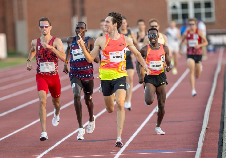 <strong>Henry Wynne gestures to a fan as he finishes first in the men's 1,500 at the Ed Murphey Classic Friday, July 12, 2024, at the University of Memphis track field. Wynne, who won the same event last year, set a new Tennessee record with a time of 3:33:33.</strong> (Greg Campbell/Special to The Daily Memphian)