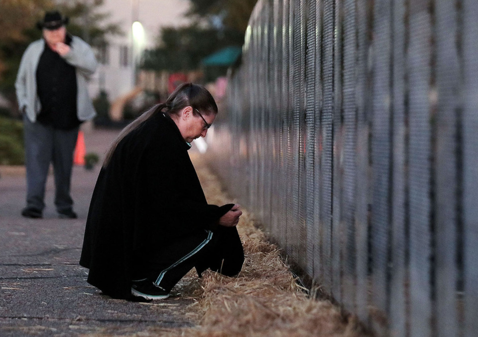 <strong>When the traveling wall was in Collierville in 2019, Ellie Vinson reflected while her husband Jim, a Vietnam veteran, walked in the background.</strong> (Patrick Lantrip/The Daily Memphian file)