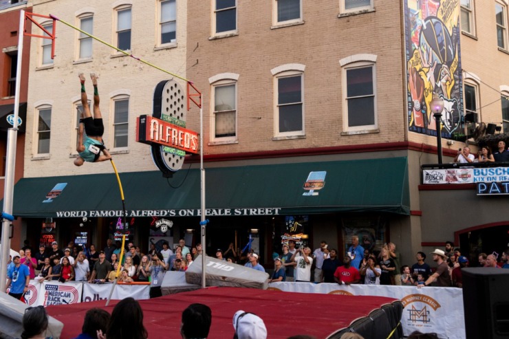 <strong>Austin Miller goes up during the John &ldquo;Buck&rdquo; Ewing PRO Men&rsquo;s Pole Vault on the final day of the Ed Murphey Classic on Beale Street.</strong> (Brad Vest/Special to The Daily Memphian)