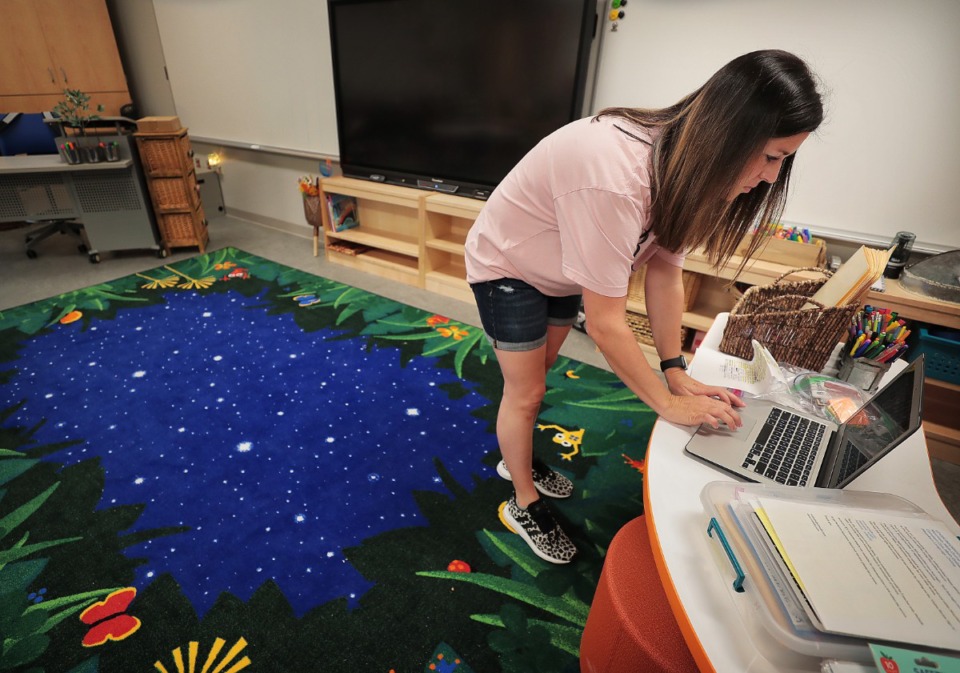 <strong>Kindergarten teacher Andrea Dancy gets her classroom ready as teachers, administrators and construction crews put the finishing touches on Germantown's new Forest Hill Elementary on Aug. 8, 2019.</strong>&nbsp;(Jim Weber/Daily Memphian)