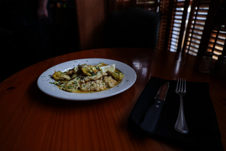 <strong>The Vitello Piccata from Correale&rsquo;s Brooklyn Bridge Italian Restaurant is perfectly executed and served with a lemon-caper wine sauce and tender artichokes.</strong>&nbsp;(Patrick Lantrip/The Daily Memphian)