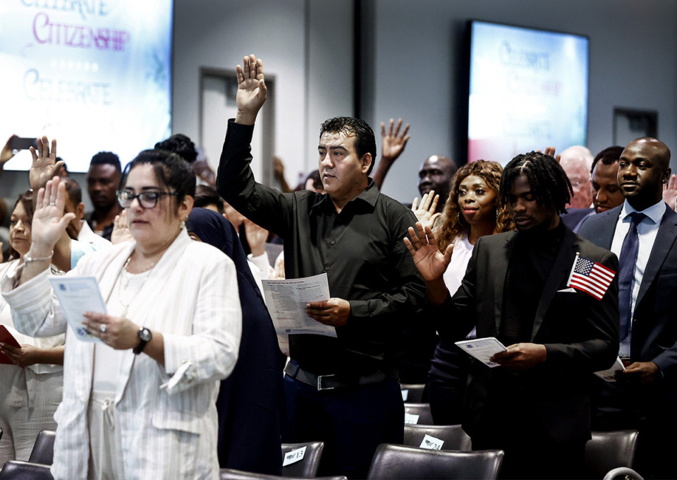 <strong>New citizens repeat the oath during a Naturalization Ceremony on Thursday, July 18, 2024 at Benjamin Hooks Central Library.</strong> (Mark Weber/The Daily Memphian)