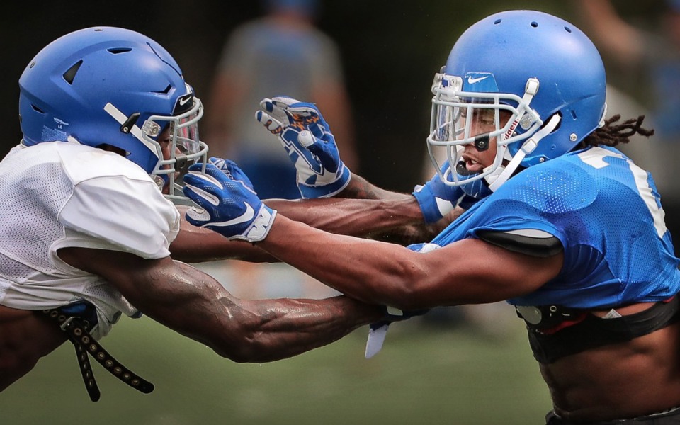 <strong>All-conference defensive back TJ Carter (right) and wide receiver Damonte Coxie face off during practice at the Billy J. Murphy Athletic Complex on Aug 8, 2019.</strong> (Jim Weber/Daily Memphian)