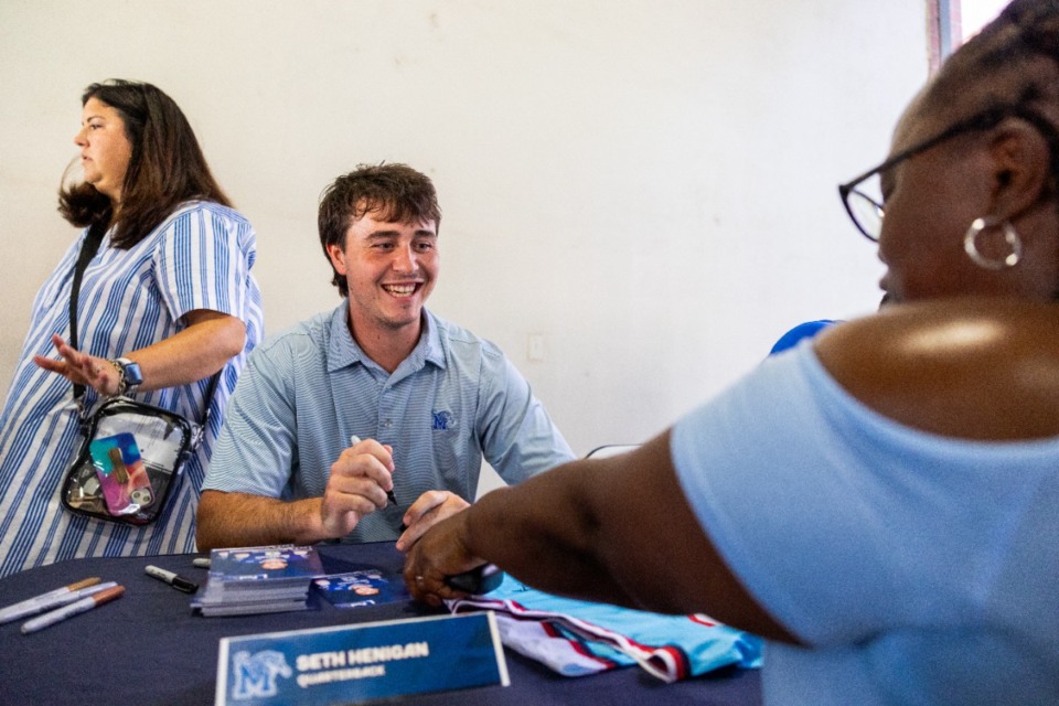 <strong>University of Memphis quarterback Seth Henigan greets fans during the Redbirds' annual U of M Night July 20</strong>. (Benjamin Naylor/The Daily