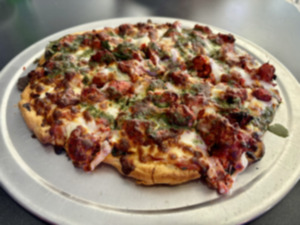 <strong>There is a pizza section on the menu at Sam&rsquo;s, which includes the 65 pizza with&nbsp;chili garlic chicken</strong>. (Joshua Carlucci/Special to The Daily Memphian)