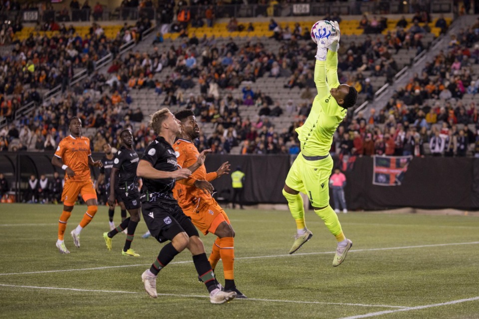 <strong>Triston Henry (1) saves a shot by Cavalry FC during the first half of the Canadian Premier League championship soccer game in Hamilton, Ontario, Saturday, Oct. 28, 2023.</strong> (Nick Iwanyshyn/The Canadian Press via AP)