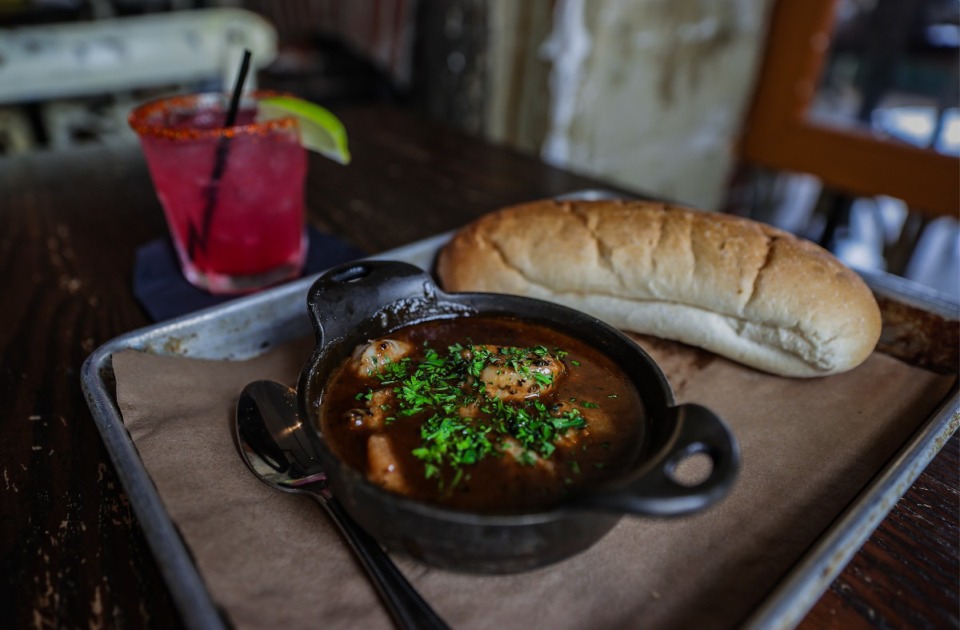 <strong>The irrationally good BBQ shrimp with a Fine and Dandy cocktail from Second Line July 26, 2024.</strong> (Patrick Lantrip/The Daily Memphian)