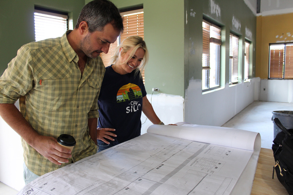 <strong>Scott, left, and Rebekah Tashie, owners of City Silo Table + Pantry, review the blueprints for the renovations of the former McAlister&rsquo;s Deli on Mendenhall where the health-focused restaurant is closing its original location in the Sanderlin Centre this fall to relocate.</strong> (Sophia Surrett/The Daily Memphian)