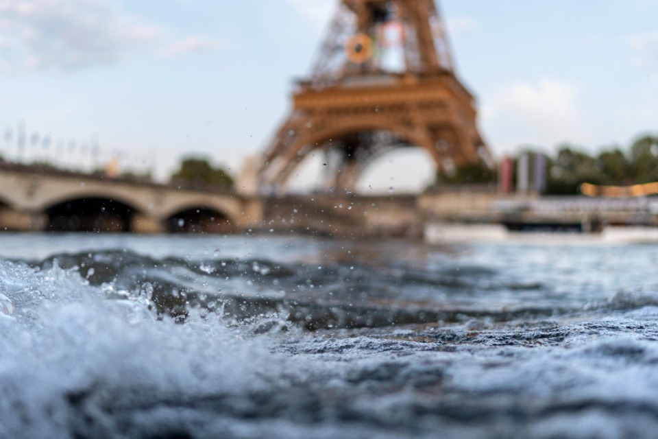 <strong>Waves crash along the banks of the Seine River in front of the Eiffel Tower during the 2024 Summer Olympics, Monday, July 29, 2024, in Paris. As the Olympics continue in Paris, the Seine River's water quality remains a major area of concern for officials.</strong>&nbsp;(David Goldman/AP)