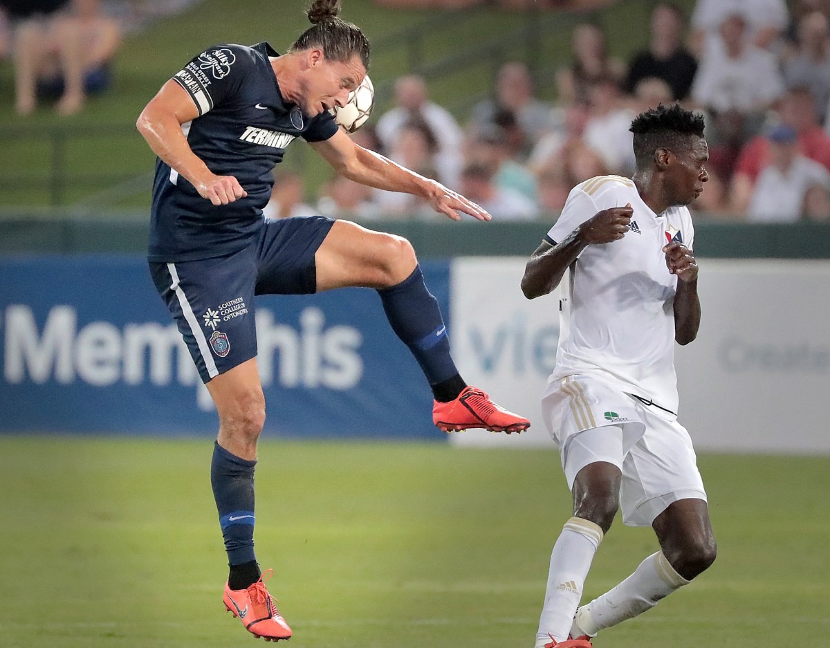 <strong>Memphis defender Marc Burch wins a header during 901FC's 2-1 loss to North Carolina FC at AutoZone Park on Aug. 10, 2019.</strong> (Jim Weber/Daily Memphian)