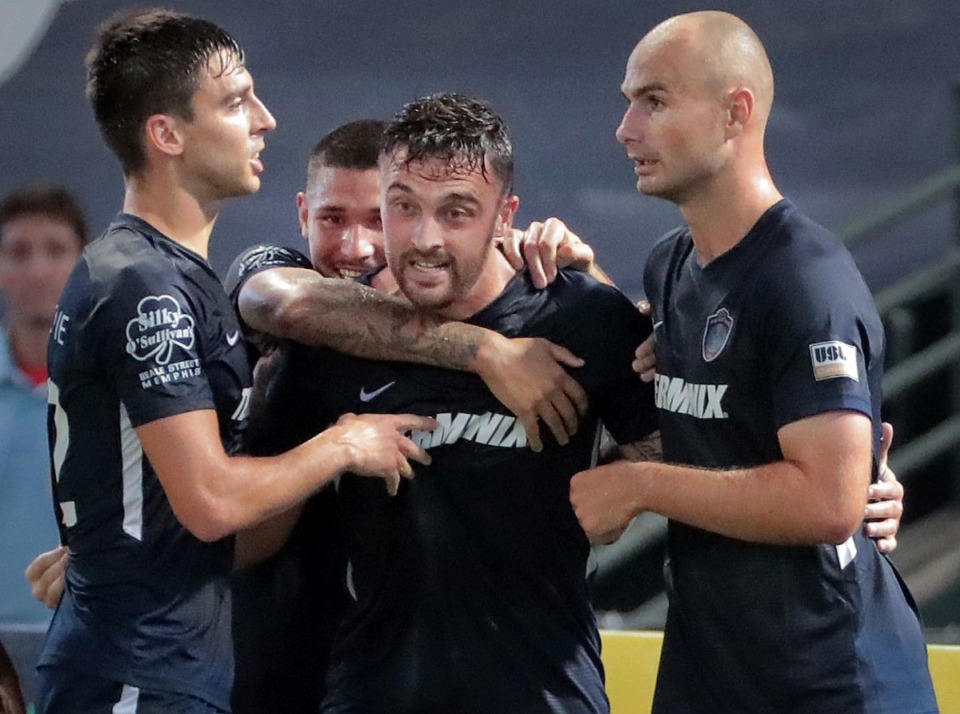 <strong>Memphis forward Brandon Allen (center) celebrates with teammates after scoring a goal during 901FC's 2-1 loss to North Carolina FC at AutoZone Park on Aug. 10, 2019.</strong> (Jim Weber/Daily Memphian)