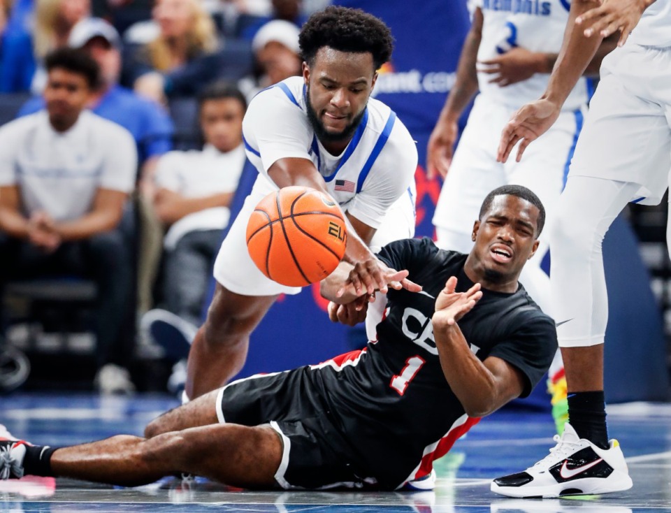 <strong>Memphis Tigers defender Alex Lomax (top) battles Christian Brothers University guard Ragi Phillips (bottom) for a loose ball during action on Sunday, October 23, 2022.</strong> (Mark Weber/The Daily Memphian file)