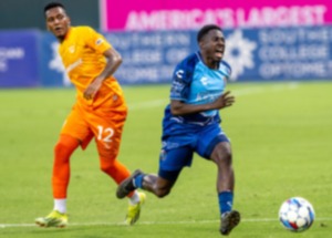 <strong>Akeem Ward (14) runs to keep the ball in bounds as El Paso's Wilmar Rivas (12) tries to defend at AutoZone Park, Saturday, Aug. 3, 2024. Memphis and El Paso played to a draw with both remaining scoreless.</strong> (Greg Campbell/Special to The Daily Memphian)