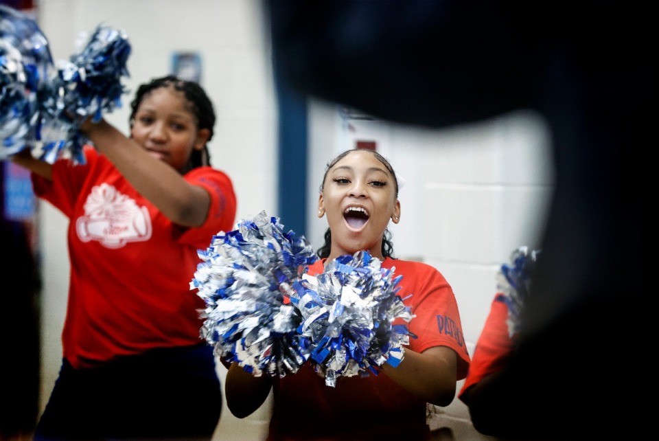 <strong>Colonial Middle School cheerleader and teachers cheer on students as they began their first day of school on Monday, Aug. 5, 2024.</strong> (Mark Weber/The Daily Memphian)