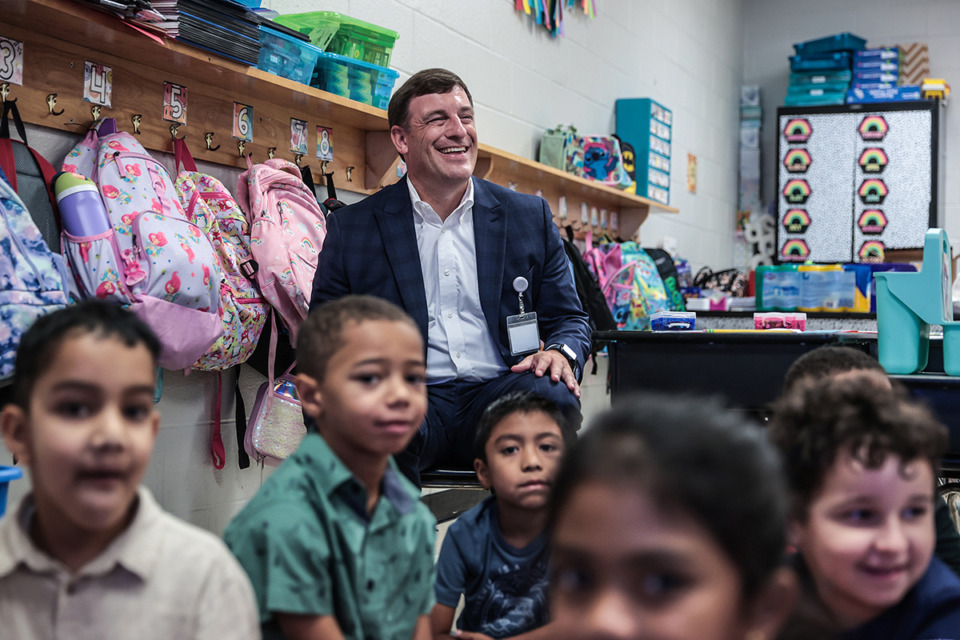 <strong>Collierville Schools Superintendent Russell Dyer sits in a first grade class on the first day of school at Sycamore Elementary School Aug. 8.</strong> (Patrick Lantrip/The Daily Memphian)