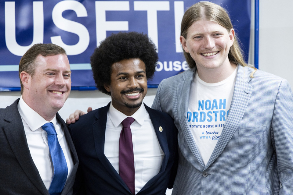 <strong>Jesse Huseth, left, Justin Pearson, center, and Noah Nordstrom, right, take a photo together during a campaign gathering and fundraiser.</strong> (Brad Vest/Special to The Daily Memphian)