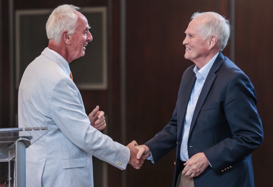 <strong>&ldquo;I have a great professional and personal privilege, and that is to recognize a remarkable health care leader &mdash; not just in Memphis, but a leader for this state &mdash; who wears his passion for healthcare right on his sleeve,&rdquo; said UTHSC Chancellor Dr. Peter Buckley (left) about Dr. Scott Morris (right). &ldquo;And he has given his all.&rdquo;</strong> (Patrick Lantrip/The Daily Memphian)