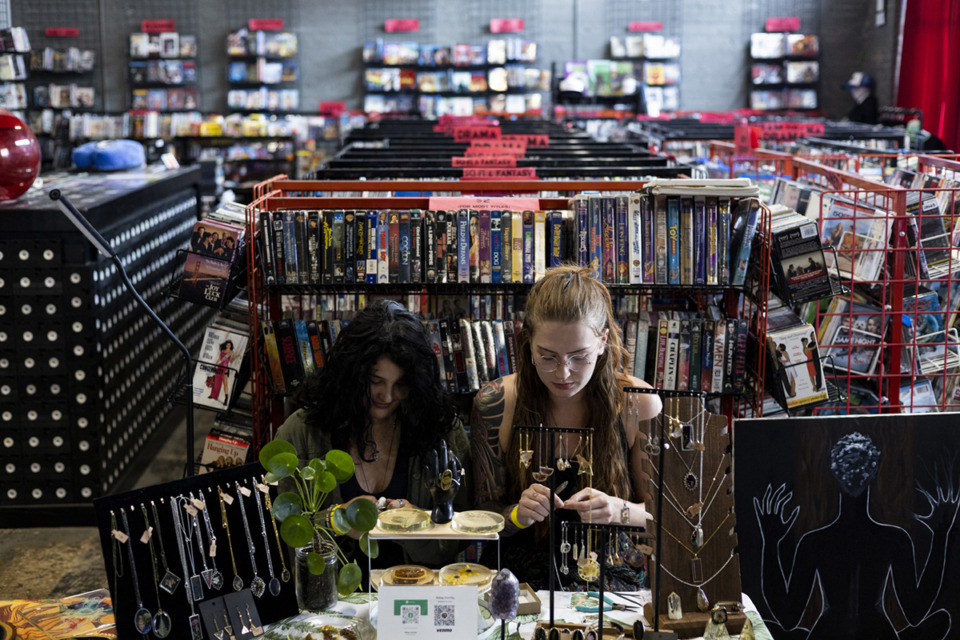 <strong>Alice Gleadhill, left, and Abbay Gourley work on jewelry at their Prima Botanica table during an art bazaar at Black Lodge Video. The video store hosted many pop-ups and events while open.</strong> (Brad Vest/Special to The Daily Memphian file)&nbsp;