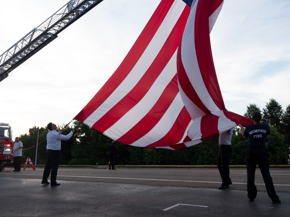 <strong>A flag is raised in honor of Memphis Police Department officer Demetrice Johnson, a Chicago native assigned to the North Main precinct.&nbsp;</strong>(Brad Vest/Special to The Daily Memphian)