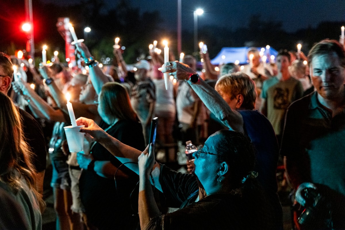 <strong>Hundreds hold aloft their candles as Aug. 15, 2024, rolls into Aug. 16, the 47th anniversary of Elvis Presley's death.&nbsp;</strong>(Brad Vest/Special to The Daily Memphian)