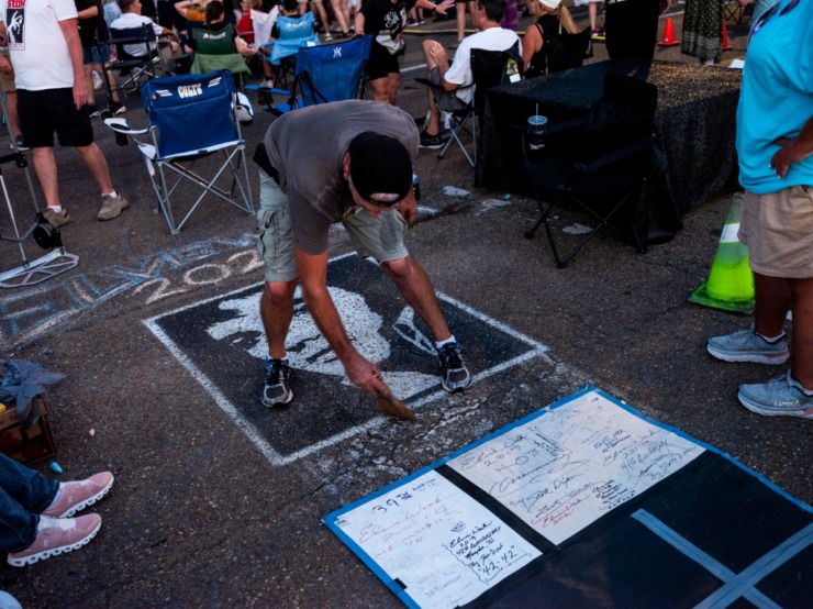 <strong>Chalk on a sidewalk becomes a work of memorial art even before the Candlelight Vigil begins.</strong>&nbsp;(Brad Vest/Special to The Daily Memphian)