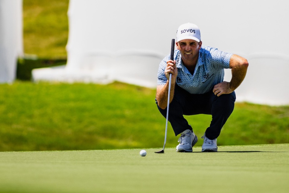 <strong>Denny McCarthy reads his putt on the 18th green at TPC Southwind during the second round of the Friday's FedEx St. Jude Championship.</strong> (Benjamin Naylor/The Daily Memphian)