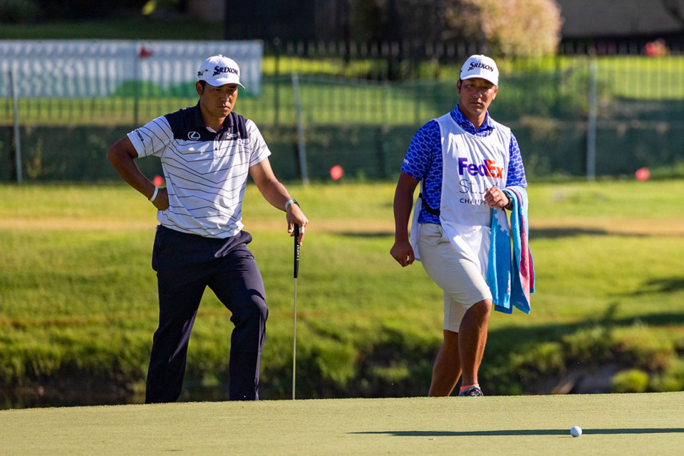 <strong>Hideki Matsuyama and his caddie Taiga Tabuchi watch as Sam Burns putts on the eighteenth hole during the third day of the FedEx St. Jude Championship Aug. 17.</strong> (Benjamin Naylor/The Daily Memphian)