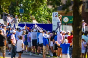 <strong>Volunteers holding &ldquo;Hush y&rsquo;all&rdquo; signs to keep spectators quiet as Scottie Scheffler tees off of hole 18 of the FedEx St. Jude Championship on Saturday, Aug. 17.</strong> (Benjamin Naylor/The Daily Memphian)