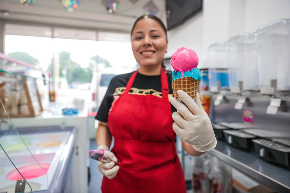 <strong>Estrella Olvera puts the finishing touches on an ice cream cone at 901 Slushies, Ice Cream &amp; Treats in Berclair. Another location will open in Bartlett.</strong> (Patrick Lantrip/The Daily Memphian)