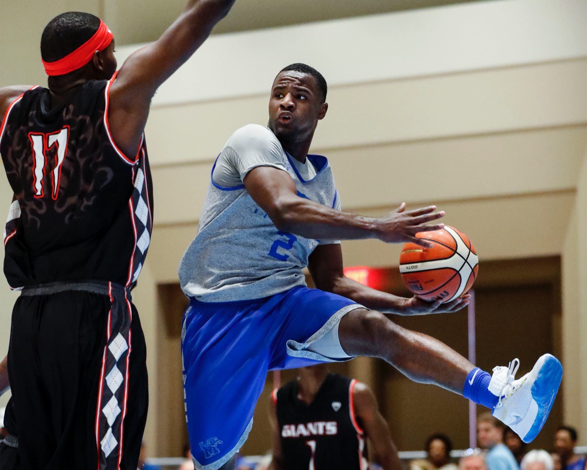 <strong>Memphis Tigers guard Alex Lomax (right) looks to make a pass around Commonwealth Bank Giants defender Cormardo Seymour (left) in the Tiger victory Wednesday in the Bahamas.</strong>&nbsp;<strong>Lomax contributed nine points and five steals.</strong> (Mark Weber/Daily Memphian).