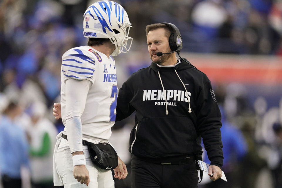 <strong>Memphis head coach Ryan Silverfield, right, talks to quarterback Seth Henigan (2) during the first half of the Liberty Bowl against Iowa State, Friday, Dec. 29, 2023.</strong> (George Walker IV/AP file)