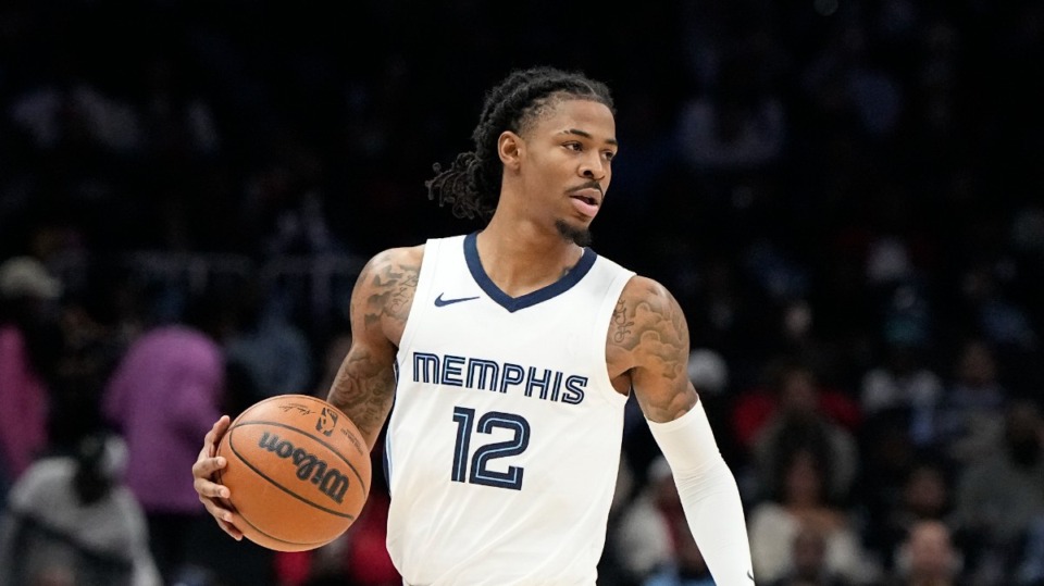 <strong>Memphis Grizzlies guard Ja Morant (12) moves the ball up court against the Atlanta Hawks during the first half of an NBA basketball game, Saturday, Dec. 23, 2023, in Atlanta.</strong> (Mike Stewart/AP Photo)