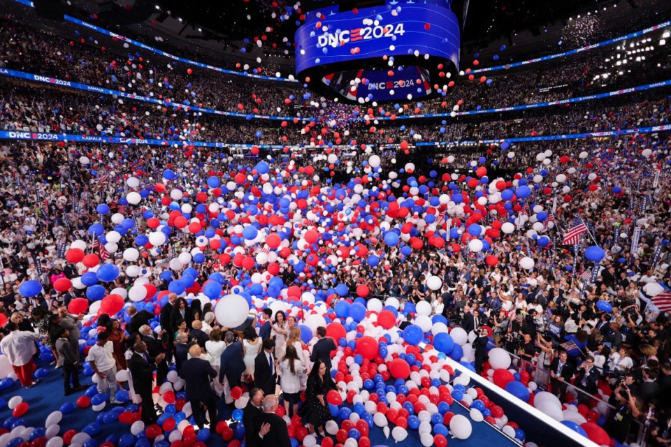 <strong>Balloons fall as Democratic presidential nominee Vice President Kamala Harris celebrates with her husband, second gentleman Doug Emhoff, Democratic vice presidential nominee Minnesota Gov. Tim Walz, his wife Gwen and their families on Day 4 of the Democratic National Convention, Thursday night, Aug. 23, 2024, at the United Center in Chicago.</strong> (Mike Segar/Pool via AP)