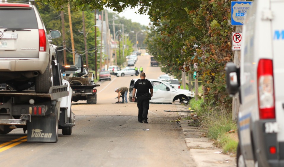 <strong>Wrecking crews hauled off the last pieces of a grisly accident on McLemore Avenue that followed a high-speed police chase through South Memphis Friday, Sept. 28, 2018.</strong> (Patrick Lantrip/Daily Memphian)