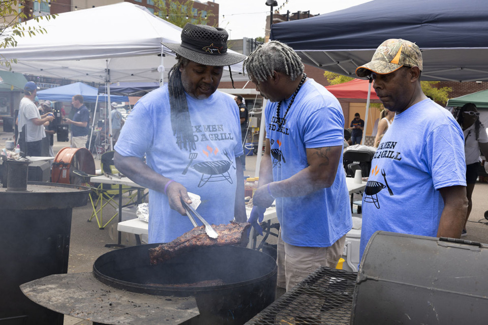 <strong>Left to right: Gregory Hailee, Mario Gibson and Frank Cotton of Six Men and a Grill prepare barbecue for judging at Patio Porkers on Beale Downtown at Handy Park Aug. 24.</strong> (Ziggy Mack/Special to The Daily Memphian)