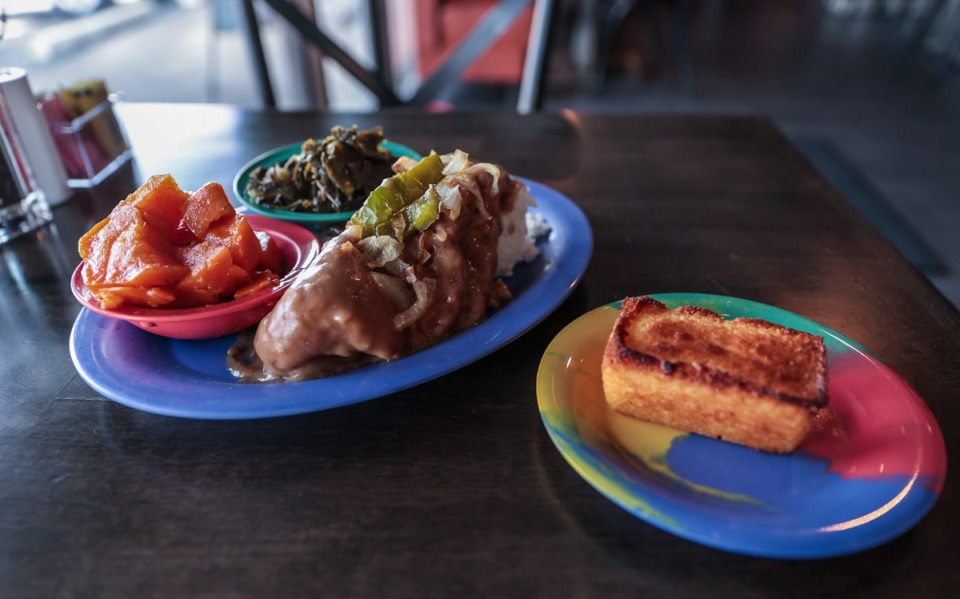 <strong>The Kam style pork chop at Southern Hands Homestyle Cooking&nbsp;is a center-cut pork chop that&rsquo;s deep fried and smothered in gravy, and topped with bell pepper and onions.</strong> (Patrick Lantrip/The Daily Memphian)