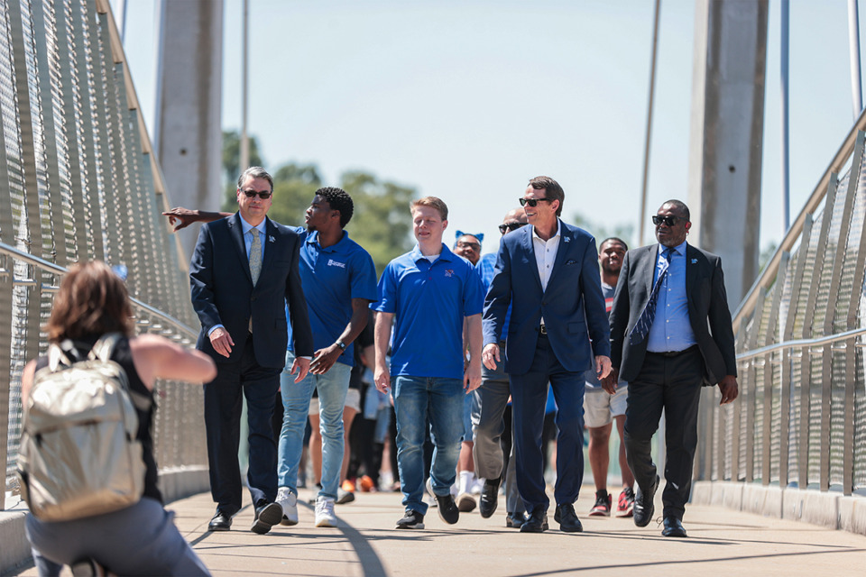 <strong>University of Memphis president Bill Hargrave crosses the The Hunter Harrison Memorial Bridge Aug. 22, 2024.</strong> (Patrick Lantrip/The Daily Memphian)