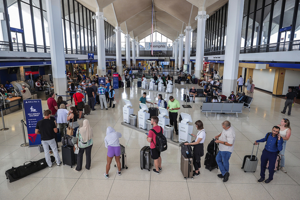 <strong>A queue of Delta Air Lines customers stretches though the Memphis International Airport July 19. </strong>(Patrick Lantrip/The Daily Memphian file)