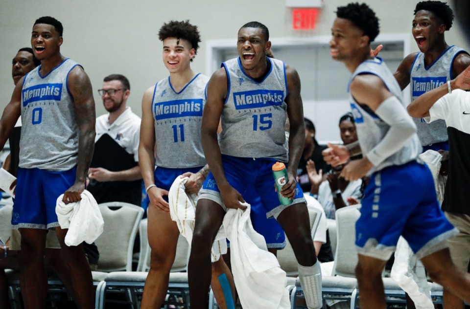 <strong>Memphis Tigers teammates (left to right) DJ Jeffries, Lester Quinones, Lance Thomas, Tyler Harris and Damion Baugh celebrate on the bench during a 135-60 victory over the NPBA Select in their exhibition game in Nassau, Bahamas, Thursday, August 15, 2019.</strong> (Mark Weber/Daily Memphian)