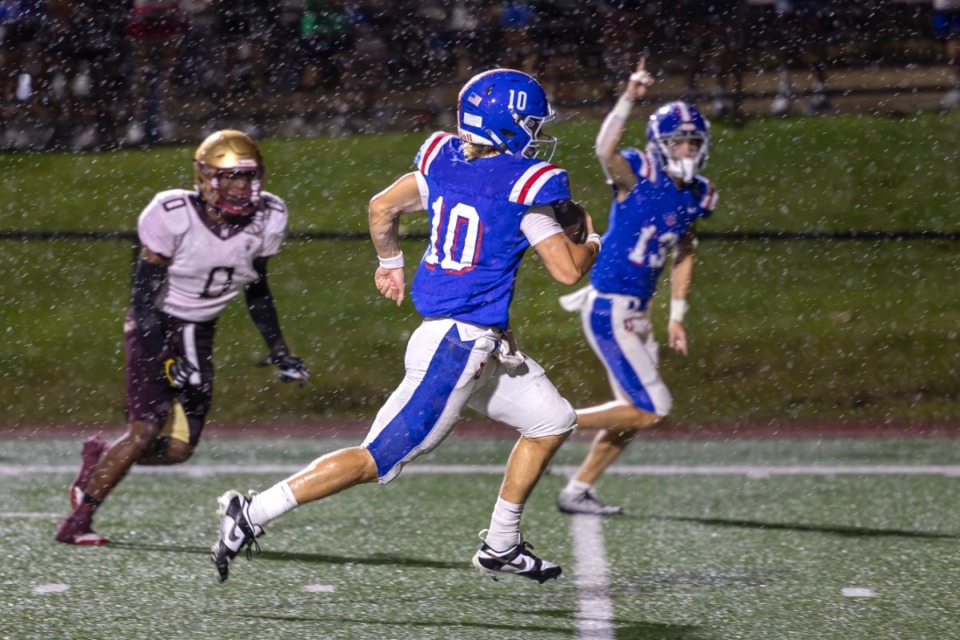 <strong>MUS quarterback Brady Hughes (10) scores a touchdown against Melrose at Memphis University School on Friday, Aug. 30, 2024.</strong> (Wes Hale/Special to The Daily Memphian)