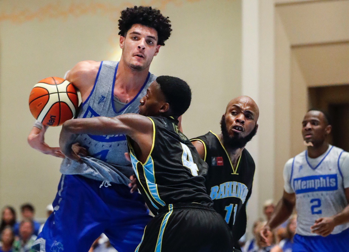 <strong>Memphis Tigers forward Isaiah Maurice (left) drives the lane against NPBA Select defender Abel Joesph (middle) during &nbsp;in Nassau, Bahamas, Thursday.</strong>&nbsp;<strong>Maurice finished with 21 points and 12 rebounds.</strong> (Mark Weber/Daily Memphian)