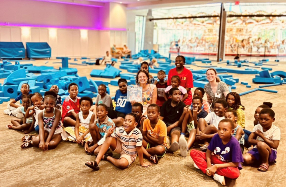 <p class="x_x_MsoNormal"><strong>The woman in the center is the artist Emily York Ozier, also known as EMYO, whose art was on display at the Children&rsquo;s Museum of Memphis and who wrote and illustrated the book&nbsp;&ldquo;Marisol&rsquo;s Dress.&rdquo;</strong> (Candace Echols/Special to The Daily Memphian)