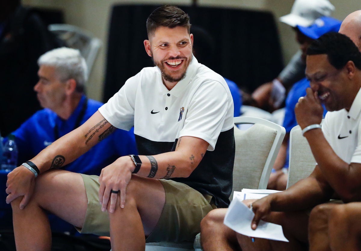<strong>Memphis Tigers assistant coach Mike Miller (left) jokes on the bench during the exhibition game Thursday in the Bahamas.</strong> (Mark Weber/Daily Memphian).