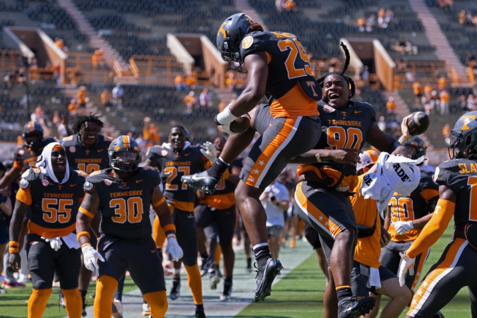 <strong>Tennessee Vols celebrate after a touchdown during the second half of an NCAA college football game against Chattanooga, Saturday in Knoxville.</strong> (Wade Payne/AP)