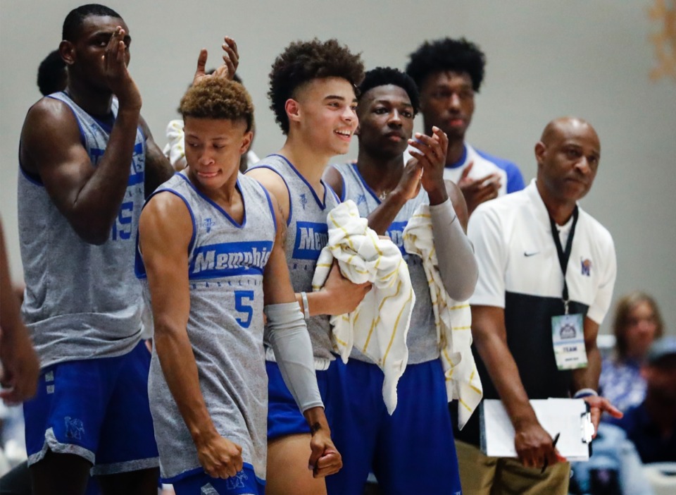<strong>Memphis Tigers celebrate on the bench during the 135-60 exhibition game victory over the NPBA Select Thursday.</strong> (Mark Weber/Daily Memphian)