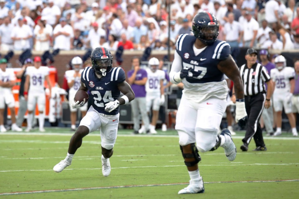 <strong>Mississippi running back Ulysses Bentley IV (24) runs the ball, while offensive lineman Micah Pettus (57) guards, during the first half of an NCAA college football game, against Furman, Saturday, Aug. 31, 2024, in Oxford, Miss.</strong> (Sarah Warnock/AP)