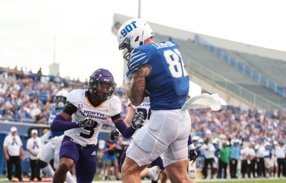 <strong>Framed by the missing section of Simmons Bank Liberty Stadium, Memphis tight end Anthony Landphere (82) hauls in a touchdown Saturday against North Alabama.</strong> (Patrick Lantrip/The Daily Memphian)