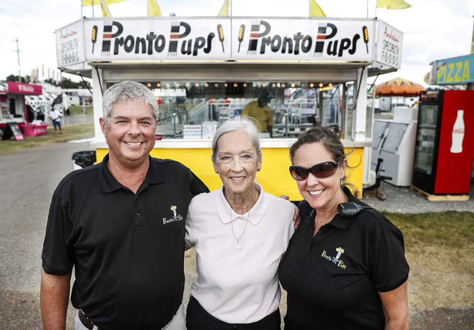 <strong>Pronto Pup owner Sharon Andreini (middle) runs the family-owned business with her children Danny Andreini Jr. (left) and Lisa Warren (right) pictured at the Delta Fair on Friday, Aug. 30, 2024.</strong> (Mark Weber/The Daily Memphian)