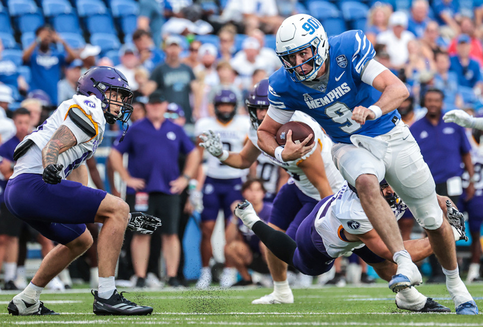 <strong>University of Memphis quarterback Seth Henigan (9) scrambles for a first down during an Aug. 31, 2024 game against N. Alabama.</strong> (Patrick Lantrip/The Daily Memphian)